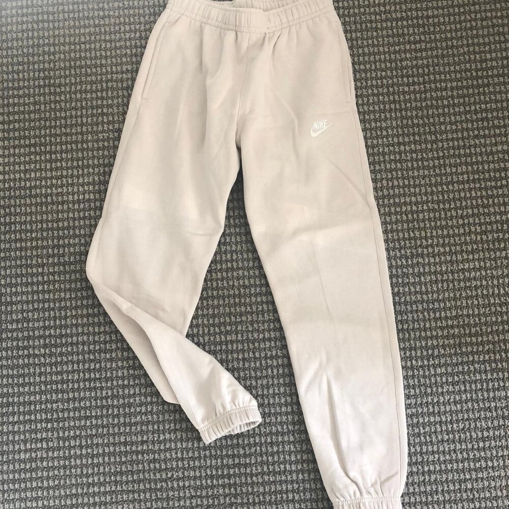 Cream Nike sweatpants with elastic waistband